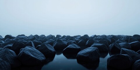 Obraz premium Long exposure shot of a rocky shore at dusk, featuring minimalist aesthetics with selective focus and a soft, grainy appearance