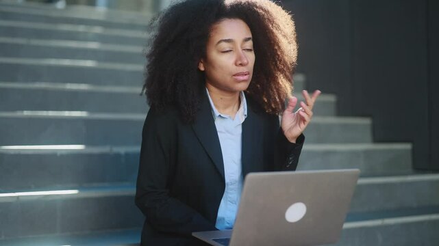 Portrait of beautiful young businesswoman thinks questioningly about difficult choice choose imagine plan in mind has doubts create idea with laptop computer at modern business centre	
