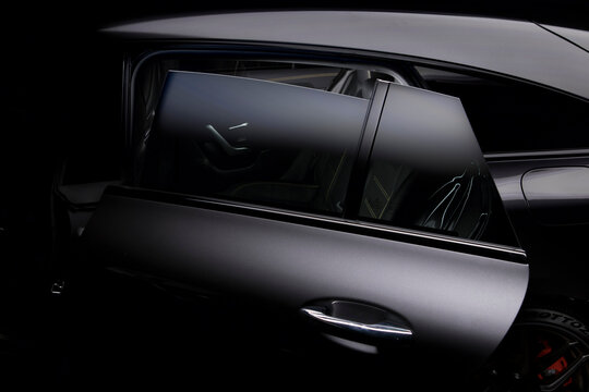 Krakow, Poland - June 14, 2024: Color: graphite or gray, Mercedes CLA 45s AMG, 241 km, year: 2020. Frameless, tinted windows. Rear windows in the doors of the Car. car Solar Glass .