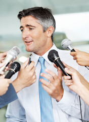 Microphone, hands and businessman with interview for media in studio for press release. Confident,...
