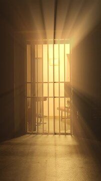 A beautiful light is shining through the cold and metal prison bars, creating a contrast