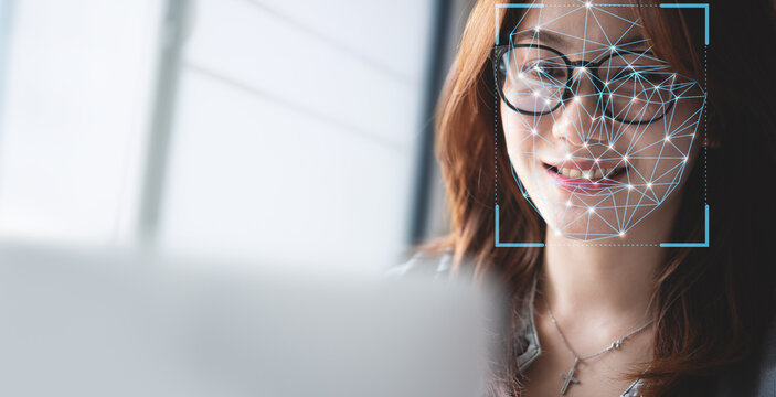 Cyber security, Data protection. Authentication by facial recognition. Biometric. Security system. Woman using computer, facial scanning to access personal data