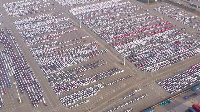 ASAN, SOUTH KOREA - OCTOBER 15, 2024: Aerial view of a large parking lot filled with new cars at a distribution center in Asan