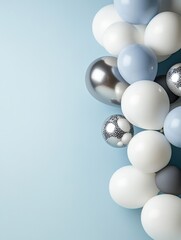Blue background with white and silver balloons and copy space