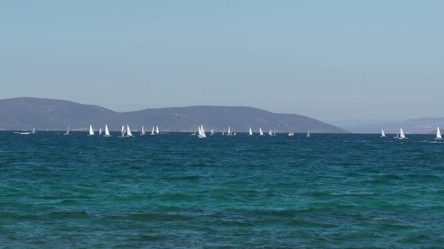 Footage of sailing yachts sailing in the sea by taking advantage of the wind power.