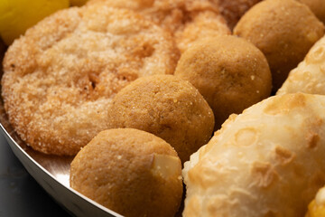 Indian sweets in a plate includes anarsa, shakkarpara morichoor  Bundi Laddu, Gujiya or Karanji for diwali celebration