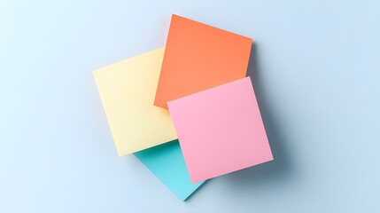 Fototapeta premium Abstract Colorful Paper Shapes on Pastel Blue Background