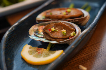 Korean food, side dishes with abalone marinated in soy sauce