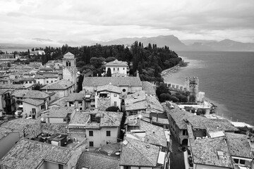 Rooftops of Sirmione, on the shore of Lake Garda, Lombardy, Italy. View from the fortress walls of the castle (Castello Scaligero di Sirmione). Black and white image.