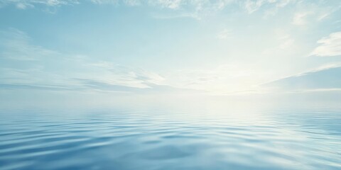 Obraz premium Serene view of calm water reflecting a clear blue sky with gentle waves.