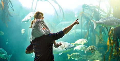 Father, kid and back with fish in aquarium for education experience, marine learning and coral...