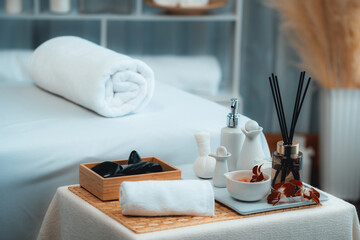 Exquisite display of beauty treatment and spa salon accessories arranged on spa table in luxury spa resort. Relaxing spa massage and recreation background concept. Quiescent
