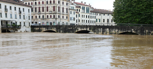 Bridge called PONTE PUSTERLA in Vicenza City during the flood and the large BACCHIGLIONE river...