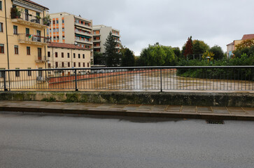 above the bridge called ponte pusterla in vicenza city in italy during the flood of the bacchiglione river mud colored