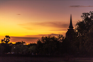 Fototapeta premium Background atmosphere inside the important historical tourist attraction Sukhothai Historical Park,foreign tourists from all over the world like to bring their children study history during holiday.