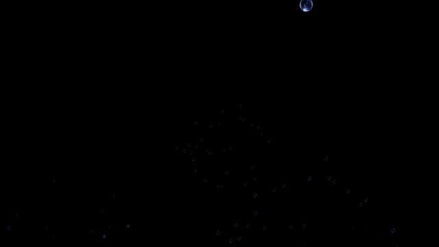 Animation soap bubble on black background.