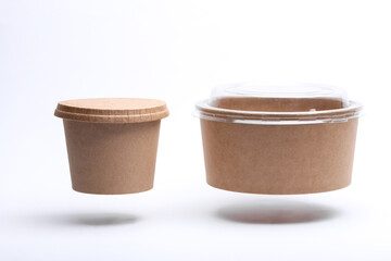 Eco cardboard round food boxes floating on white background