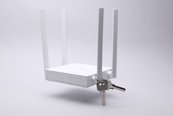 Modern four-antenna Wi-Fi router with keys floating on gray background.