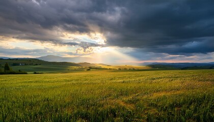 Obraz premium Sunlight penetrates the clouds, the contrast between the dark clouds and the light creates a feeling of hope that breaks through the gloom