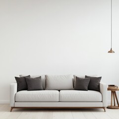 A modern two-seater sofa in neutral shades with dark pillows, placed in a minimalist room for elegant comfort.