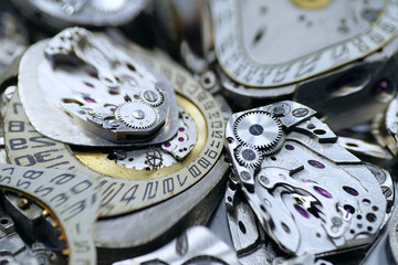 Old mechanical watches with gears and cogs. Watch or clock mechanisms
