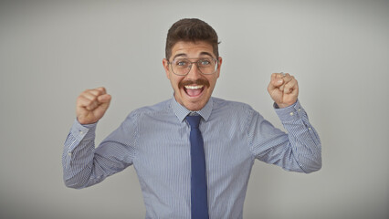 Excited hispanic man in shirt and tie with glasses and moustache celebrating on a white background