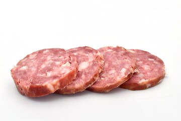 Slices of sliced ​​salami sausage lie on a white background.