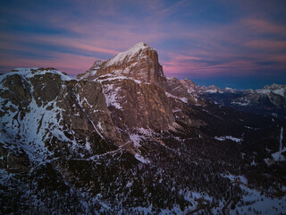 Vibrant colorful sunset in Dolomites, Italy. Monte Lagazuoi in winter is covered with snow