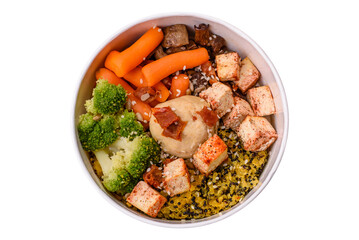 Colorful vegan vegetarian dish consists of tofu, broccoli, quinoa, mushrooms