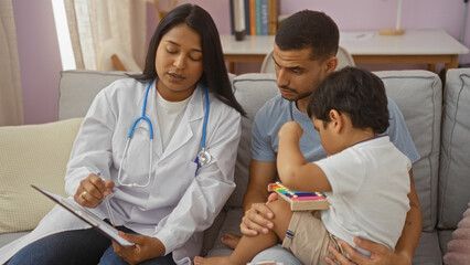Pediatrician explaining to father while his son plays in living room
