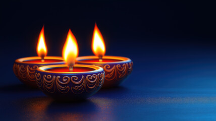 Beautiful ceramic diya lit for Diwali with festive decorations on stunning dark blue background
