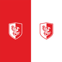 A striking emblem showcases a regal phoenix, elegantly designed within a shield, exuding an aura of nobility and fortitude