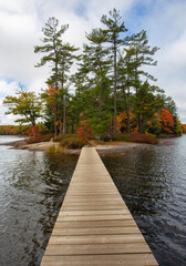 Wooden Bridge to Island on Hardy Lake in Muskoka, Canada.