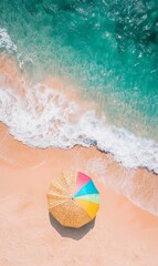 Naklejka premium Beach umbrella on sand with turquoise water.