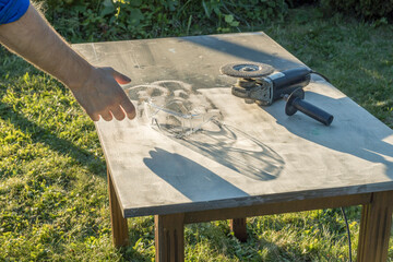 A man is working on a project on a table