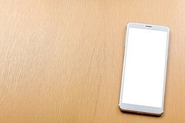 Empty smartphone placed on light wooden table during daylight hours