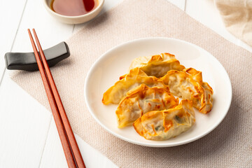 Airfryer gyoza,Use Air Fryer grilled dumplings pork and vegetables on white plate