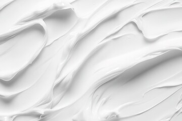 Fototapeta premium White cosmetic cream background, close-up of a white skincare product texture with smooth lines