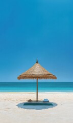 Beach umbrella on a white sand beach.