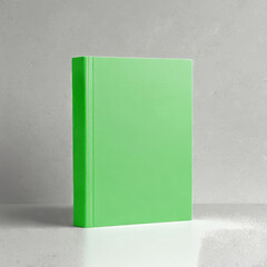 A light green hardcover book mockup on a light background. Perfect for showcasing designs, titles or branding elements.