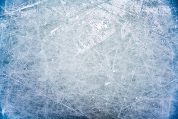 Ice background with marks from skating and hockey. blue texture