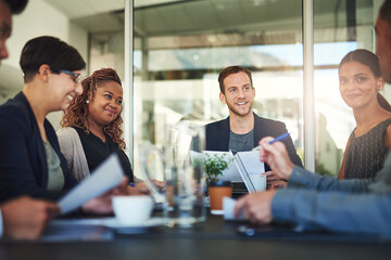 Business, people and happy in meeting at boardroom for brainstorming, strategy and feedback as project managers. Employees, office and smile or satisfied with documents for report, reviews and growth