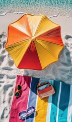 Beach umbrella, towel, sunglasses, and bag.