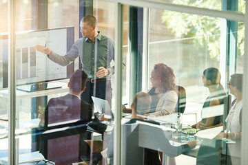Business, team and tech in boardroom for training, productivity report and feedback chart. Man...