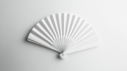 A simple white folding hand fan laid flat on a clean white surface, ideal for branding and mockup designs.