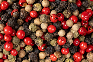 Background of a mix of colorful peppercorns top view