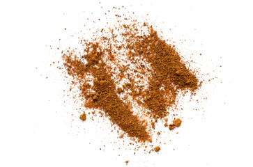 Heap of cinnamon powder isolated on white background, top view. Cinnamon powder isolated on white background, top view. Pile of cinnamon powder on a white background, top view.