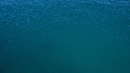 A serene view of the deep blue sea in polignano a mare, italy, showcasing the tranquil outdoor setting wrapped in the untouched beauty of puglia.