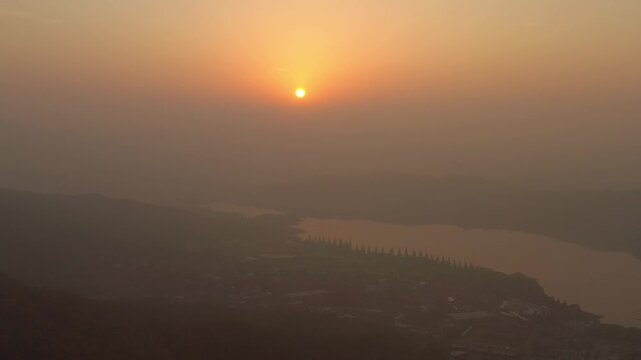 ASAN, SOUTH KOREA - OCTOBER 16, 2024: Scenic sunrise over the Han River showcasing the tranquil beauty of nature and the awakening city landscape