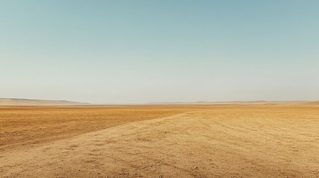 A vast desert slowly overtakes dry agricultural land evoking a sense of loss